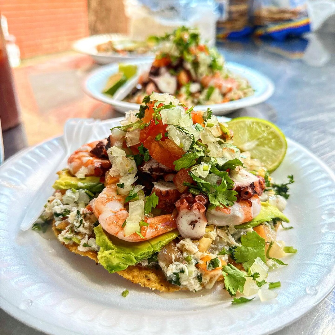 A taco filled with shrimp and vegetables.