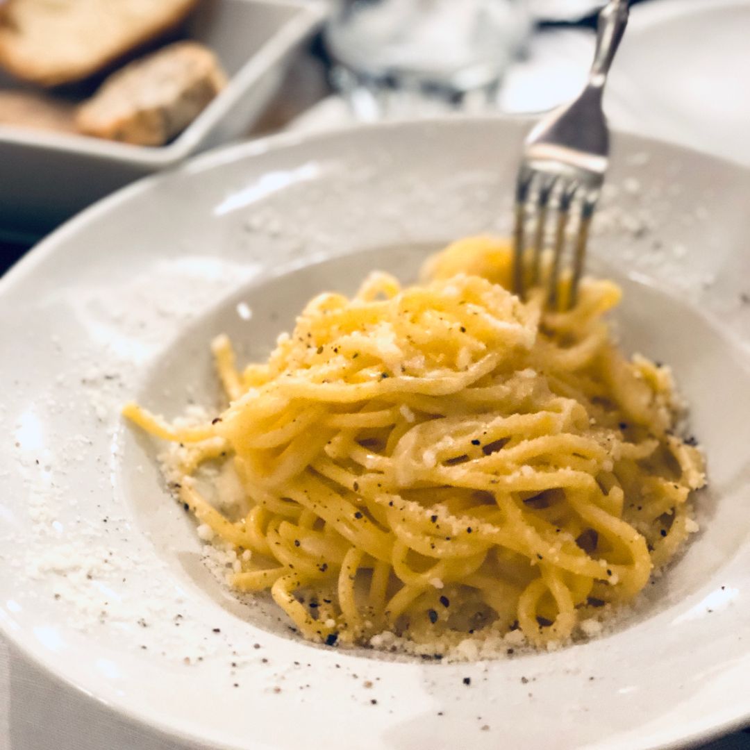 Parmesan pasta on a plate.