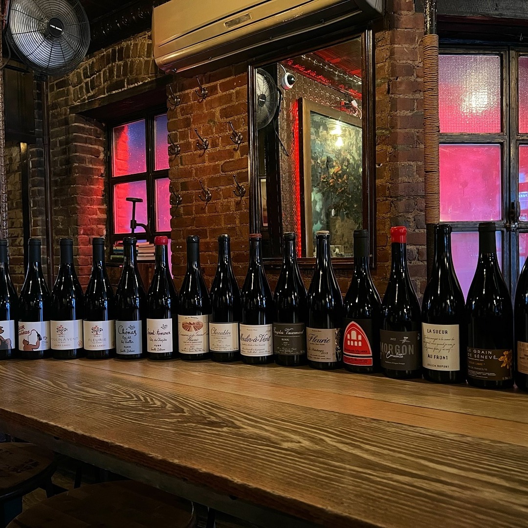 Wine bottles on a table.