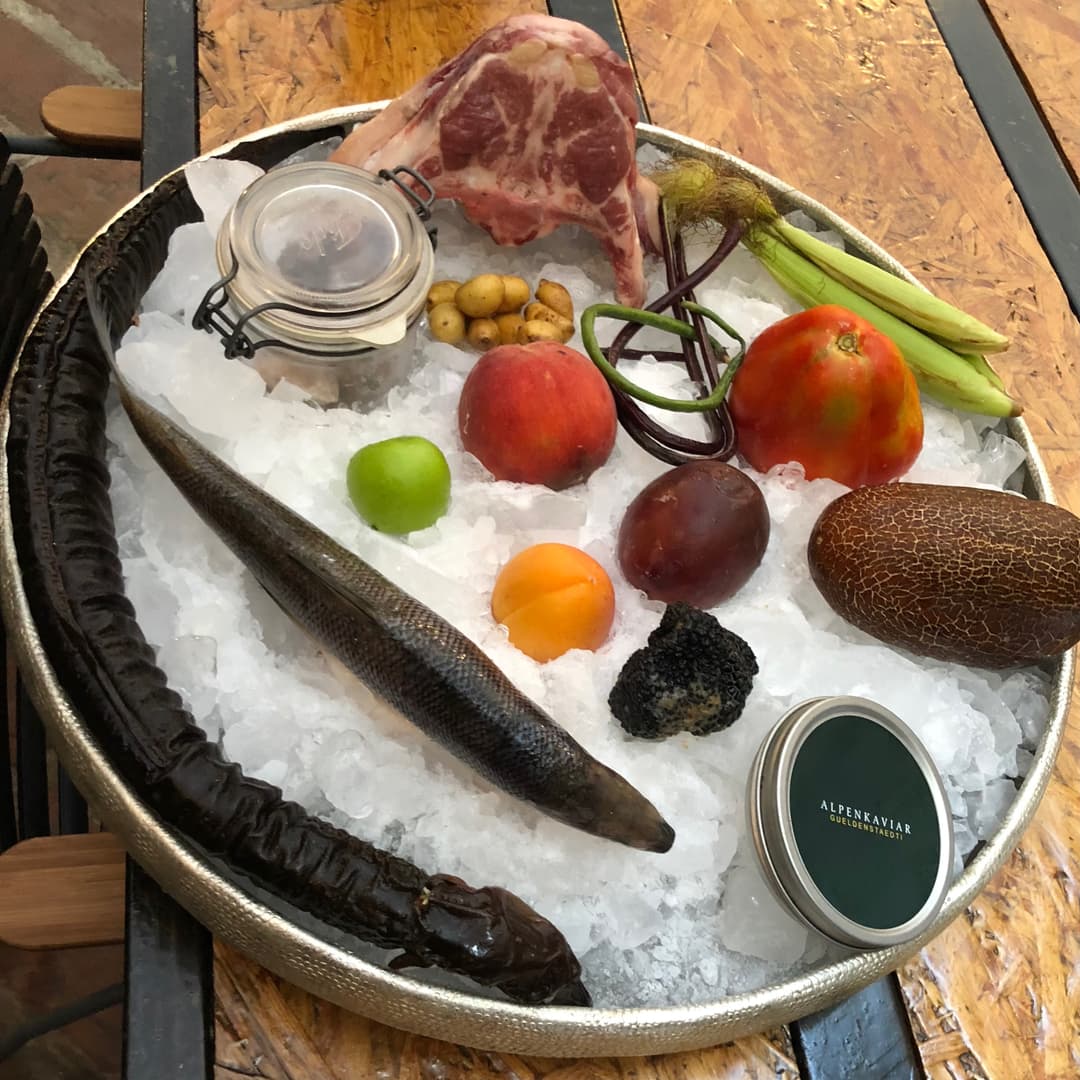 Fish, meat and fruits on ice.