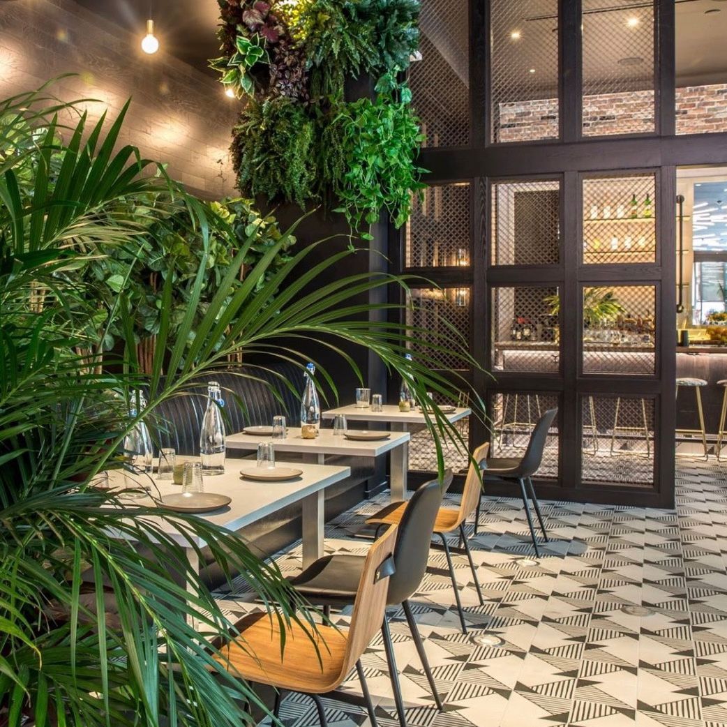 Restaurant interior with greens.